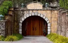  ?? Jessica Christian/The Chronicle ?? The entrance to the barrel cave at the Bordeaux-inspired Cathiard Vineyard in St. Helena.