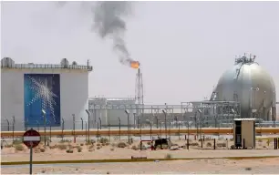  ?? Reuters ?? A gas flame is seen in the desert near the Khurais oilfield, Saudi Arabia. —