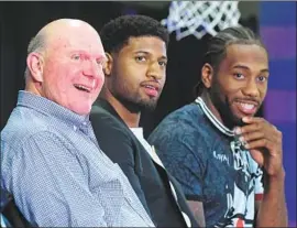  ?? Wally Skalij Los Angeles Times ?? CLIPPERS owner Steve Ballmer, left, was all smiles with Paul George, center, and Kawhi Leonard in July. Doc Rivers says that the deals almost fell apart.