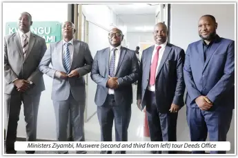  ?? ?? Ministers Ziyambi, Muswere (second and third from left) tour Deeds Office