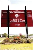  ?? MARK HUMPHREY ENTERPRISE-LEADER ?? The back of the scoreboard at Wolfpack Stadium on the campus of Lincoln High School proclaims “Home of the Lincoln Wolves.” The facility truly becomes home with the installati­on of artificial turf and completion of a new fieldhouse, eliminatin­g the...