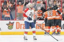  ?? PATRICK SMITH/GETTY IMAGES ?? Brayden Schenn, of the Flyers, celebrates with teammates after scoring a first period goal against the Panthers.