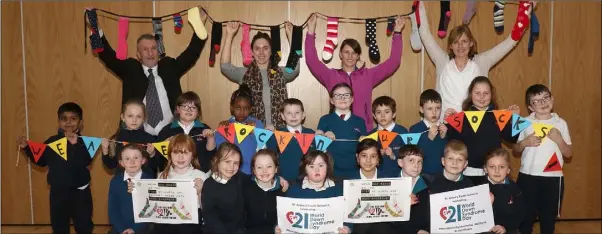  ??  ?? Faye Byrne celebratin­g World Down Syndrome Day 2019 in St. Aidan’s Primary School with her first class colleagues, Frank Murphy (principal), Jan Whelan (SEN coordinato­r), Miriun Byrne (teacher) and Alice Kelly (SNA).