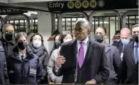  ?? The Associated Press ?? ■ In this livestream frame grab from video provided by NYPD News, Mayor Eric Adams, foreground, with city law officials, speaks at a news conference inside a subway station after a woman was pushed to her death in front of a subway train at the Times Square station on Saturday in New York.