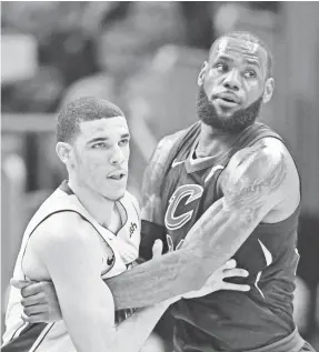  ??  ?? After playing against each other last season, Lonzo Ball and LeBron James are set to be teammates.