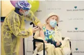  ?? LYNNE SLADKY/AP ?? Cynthia Banada, RN, gives a vaccine to Luz Collazo, 103, at Miami Jewish Health in Miami.