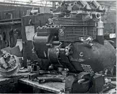  ??  ?? Roarer engine in the Velocette workshop. Clamps for the frame tubes can clearly be seen, with the rear hub on the bench.