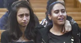  ?? AFP ?? Young Egyptian women mourn victims, killed in an attack a day earlier, during an early morning ceremony at the Prince Tadros church in Egypt’s southern Minya province yesterday.