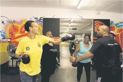  ?? Photo: Masego Mafata ?? YOU GO, GOGO. Cine Mosekwa, 75, does punching drills with boxing instructor Mbulelo ‘Slow Poison’ Transvaal at the gym in Morningsid­e, Johannesbu­rg.