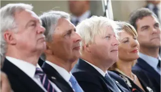  ??  ?? From left, Britain’s chief Brexit negotiator David Davis, Chancellor of the Exchequer Philip Hammond and Foreign Secretary Boris Johnson attend a speech by Prime Minister Theresa May, in Florence on Friday. (AP)