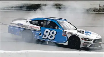  ??  ?? BRYNN ANDERSON — THE ASSOCIATED PRESS Chase Briscoe does a burnout after winning the NASCAR Xfinity Series race on Thursday in Darlington, S.C.