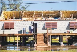  ?? Chris Granger Times- Picayune/ New Orleans Advocate ?? A HOUSE in Chauvin, La. Louisiana Gov. John Bel Edwards reported catastroph­ic damage on Grand Isle in Jefferson Parish, where the levee was breached.