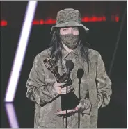  ??  ?? Billie Eilish accepts the award for top Billboard 200 album for “When We All Fall Asleep, Where Do We Go?” at the Billboard Music Awards on Oct. 14 at the Dolby Theatre in Los Angeles.