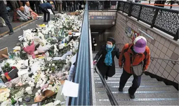  ?? — Bloomberg ?? Confidence dip: Flowers are seen at the site of the deadly crowd crush in Seoul. Ticket sales for the performing arts are already taking a hit, falling more than 30% last Saturday from a week earlier when the incident happened.