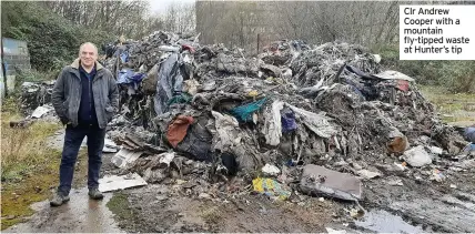  ??  ?? Clr Andrew Cooper with a mountain fly-tipped waste at Hunter’s tip