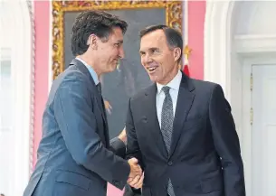  ?? CHRIS WATTIE AFP FILE PHOTO VIA GETTY IMAGES ?? Finance Minister Bill Morneau is clearly in play, numerous sources told Heather Scoffield. He can no longer count on his job being protected by the tacit support of Prime Minister Justin Trudeau.