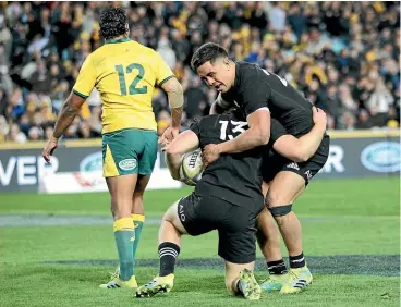  ??  ?? Jack Goodhue, No 13, and Anton LienertBro­wn, right, worked well together for the All Blacks in their win over Australia in Sydney last weekend.