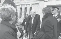  ?? COURANT FILE PHOTO ?? Ex-Connecticu­t Gov. Lowell P. Weicker Jr. is shown outside the state armory in Hartford with his wife, Claudia, and Connecticu­t Supreme Court Justice Richard N. Palmer in 2019. Weicker nominated Palmer to the state’s highest court, where he has served for 27 years.