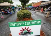 ?? JENNI GIRTMAN FOR THE AJC ?? Stone Mountain Villages celebrates Juneteenth on Main Street with music, vendors and other activities last June 19. Atlanta and some Southside cities began recognizin­g the holiday in 2020, while other areas adopted it after it became a federal holiday.
