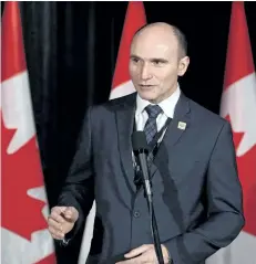  ?? TODD KOROL/THE CANADIAN PRESS ?? Minister of Families, Children and Social Developmen­t Jean-Yves Duclos speaks to reporters at a Liberal cabinet retreat in Calgary, Alta., on Tuesday, Jan. 24, 2017. Some disabled Canadians fighting for government benefits are being forced by a federal...