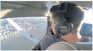  ??  ?? RIGHT Aaron Ludomirski, certified flight instructor for Infinity Flight Group, flies over the Hudson River in New York in this image made from a video.
