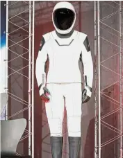  ?? — Reuters ?? Suit up: The new SpaceX launch and entry spacesuit being displayed at Nasa’s Johnson Space Center.