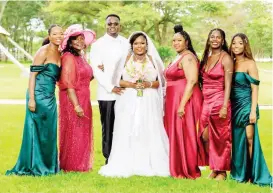  ?? ?? Kayode Agbalajobi and his bride Matipa pose for a photograph with Mrs Linda Chindori-Chininga, the bride’s mother (second from left), and their bridal team