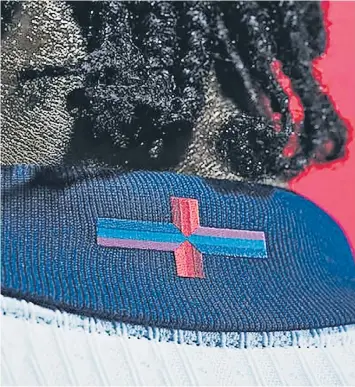  ?? ?? The multi-coloured St George’s Cross on the back of the new England football kit has been branded ‘an absolute joke’ by MPS