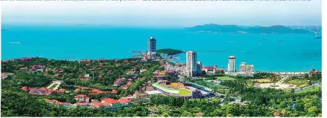  ?? ZHANG XIAO / FOR CHINA DAILY ?? The Western-styled buildings along Qingdao’s coast are a major attraction for tourists to the city.