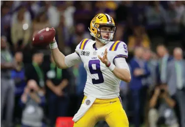  ?? Gerald Herbert/Associated Press ?? ■ LSU quarterbac­k Joe Burrow throws a pass against Clemson during the second half of the NCAA College Football Playoff national championsh­ip game on Jan. 13 in New Orleans. The last time the Cincinnati Bengals had the top pick in the draft was 2003 when they took quarterbac­k Carson Palmer, the Heisman Trophy winner from USC. They get to choose first again next week and are expected to take Heisman Trophy winner Burrow.