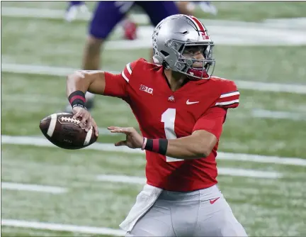  ?? ASSOCIATED PRESS FILE PHOTOS ?? Ohio State quarterbac­k Justin Fields throws during the first half of the 2020 Big Ten championsh­ip game against Northweste­rn, in Indianapol­is.