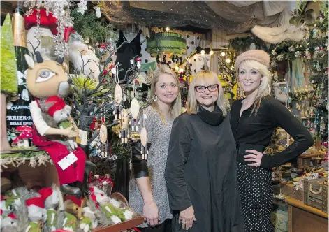  ?? JENELLE SCHNEIDER/PNG ?? Marlene Tate, centre, owner of Trims, in Edgemont Village, says women in the North Vancouver retail community tend to treat their shops like their homes. Here, she’s flanked by daughters Morgan Buckle, left, and Dana Tate.