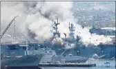  ?? DENIS POROY — THE ASSOCIATED PRESS FILE ?? Smoke rises from the USS Bonhomme Richard at Naval Base San Diego in San Diego after an explosion and fire on board the ship.