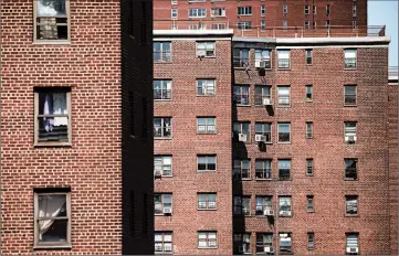  ?? DREW ANGERER/GETTY 2018 ?? The Alfred E. Smith Houses, a public housing developmen­t built and maintained by the New York City Housing Authority, stand in the Lower East Side of Manhattan.