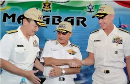  ??  ?? Vice-Admiral H.C.S. Bisht, Flag Officer Commanding-in-Chief, Eastern Naval Command (centre), with Japan’s ViceAdmira­l Hiroshi Yamamura (left) and the US Navy’s Rear Admiral William D. Byrne Jr (right), at the launch of "Malabar" naval exercises on...