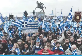  ??  ?? THESSALONI­KI: People holding flags of Greece take part in a demonstrat­ion to protest against the use of the name Macedonia following the developmen­ts on the issue with the neighbor country yesterday. —AFP