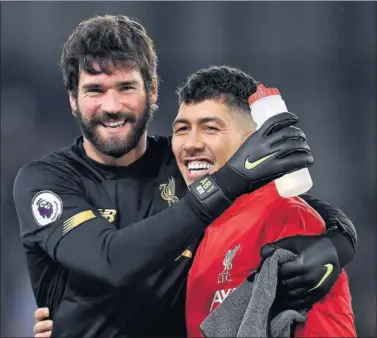  ??  ?? Alisson y Firmino, que no fueron liberados por el Liverpool para la fecha de clasificac­ión con Brasil