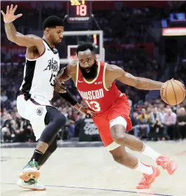  ?? — AFP file photo ?? James Harden #13 of the Houston Rockets dribbles past Paul George #13 of the Los Angeles Clippers during the first half of a game at Staples Centre in Los Angeles, California.