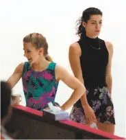  ?? John Tlumacki / Boston Globe via Getty Images 1994 ?? Tonya Harding (left) and Nancy Kerrigan share the ice during a practice session for the 1994 Olympics.