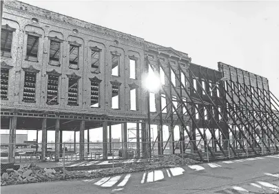  ??  ?? Sun shines through the windows of Beale Street buildings being restored across from Handy Park in December 1980. The city launched the Beale Street Historic District in 1983 with $13.5 million in city, federal and private funds to recapture the glory of the world renowned street that is recognized as the home of the blues and the one-time center of black culture in Memphis. BARNEY SELLERS/THE COMMERCIAL APPEAL