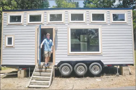  ??  ?? Vicksburg, Miss., native David Osburn stands outside the 221-square-foot tiny house he designed and built as a teenager in Vicksburg. “I’ve always been somebody that likes to tinker with things, but I guess it really started when I saw a video on YouTube of a guy who converted a short bus into a tiny house. I said, ‘Hey, that’s pretty cool.’ Then I said I’ll sketch out my own design,” he said.
(The Vicksburg Post/Courtland Wells)