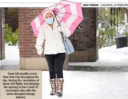  ?? CINDY ORD/AGENCE FRANCE-PRESSE ?? NEW York’s Central Park is enveloped in white as a woman walks through amid a winter weather advisory that a total of 6 to 8 inches of snow is expected before the weekend.