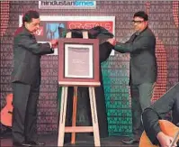  ??  ?? Rajiv Verma, CEO HT Media Ltd and Rajan Bhalla, Head, Corporate Marketing and Magazines, HT releasing the coffee table collectibl­e, Magic of Print