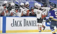  ??  ?? Max Jones (49) is congratula­ted by teammates after his secondperi­od goal put the Ducks ahead 2-0 against the St. Louis Blues.