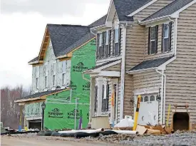  ?? [AP PHOTO] ?? New home constructi­on is shown in Zelienople, Pa. On Wednesday, the Commerce Department reports homes sales slumped in July.