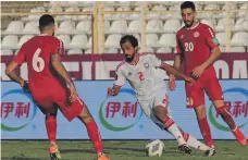  ?? AFP ?? Mohammed Al Menhali, centre, during the World Cup qualifying win over Lebanon earlier this month