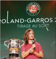  ?? Michel Euler / Associated Press ?? Defending champion Barbora Krejcikova speaks next to the cup during the draw of the French Open at the Roland Garros stadium in Paris on Thursday.