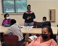  ?? (Pine Bluff Commercial/Eplunus Colvin) ?? Dominique Graydon, community relations officer with the Pine Bluff Police Department, addresses residents during Tuesday’s meeting.