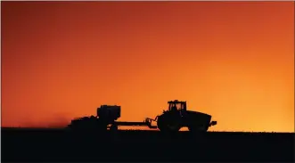  ?? JIM SLOSIAREK — THE GAZETTE VIA AP, FILE ?? A field is planted near Walford, Iowa, last spring. Thanks to the government paying nearly 40% of their income, U.S. farmers are expected to end 2020 with higher profit than 2019 and the best net income in seven years, the Department of Agricultur­e said in its latest farm income forecast.