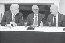  ?? CHIP SOMODEVILL­A, GETTY IMAGES ?? From left, President Trump, Microsoft CEO Satya Nadella and Amazon CEO Jeff Bezos attend a meeting of the American Technology Council on June 19 at the White House.